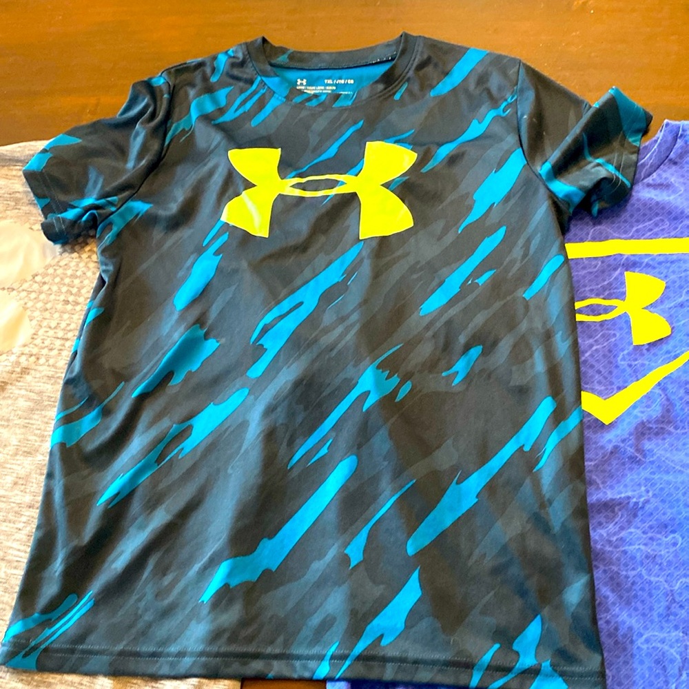 $13 -3 Under Armour xl youth shirts.